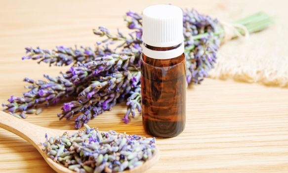 Lavender essential oil in a small bottle. Selective focus. nature.