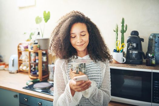 Portrait of a beautiful girl enjoying coffee and social media