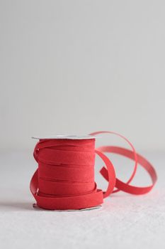 Red velvet decorative ribbon skein on white background
