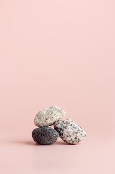 Set of stones pink background Vertical Copy Space