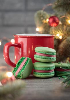 Sweet dessert - green christmas macaroons on a gray background