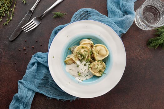Served dumplings in a plate top view