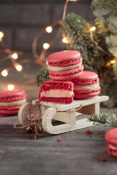 Sweet dessert - red christmas macaroons on a gray background