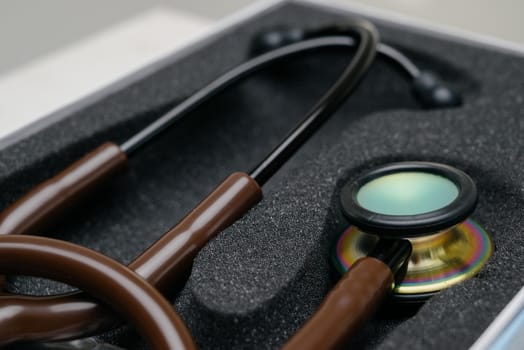 Medical stethoscope. Brown medical stethoscope.The concept of healthcare.Stethoscope on a dark background