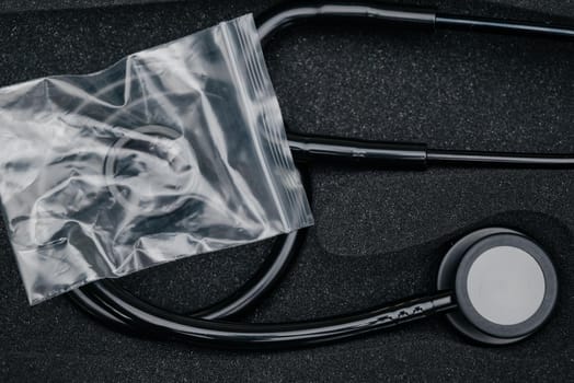 Medical stethoscope. Black medical stethoscope.The concept of healthcare.Stethoscope on a dark background