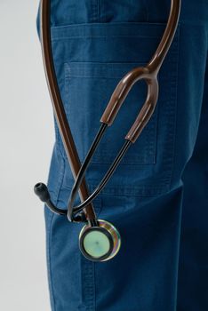 Brown medical stethoscope.A doctor with a stethoscope.A doctor holding a stethoscope.The concept of healthcare.