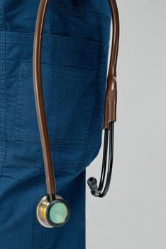 Brown medical stethoscope.A doctor with a stethoscope.A doctor holding a stethoscope.The concept of healthcare.