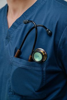 Brown medical stethoscope.A doctor with a stethoscope.A doctor holding a stethoscope.The concept of healthcare.