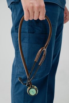 Brown medical stethoscope.A doctor with a stethoscope.A doctor holding a stethoscope.The concept of healthcare.