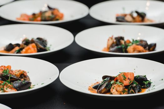 the chef prepares a seafood dish