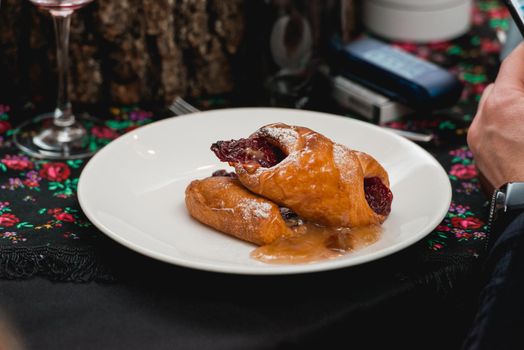 flying buns with fruits on a white plate.