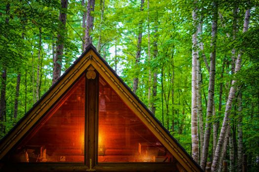 Image of Lodge standing in the forest. Shooting Location: Hokkaido Furano