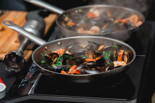 the chef prepares a seafood dish