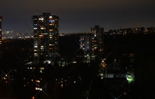 Night cityscape with light star effect.