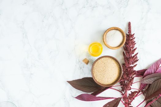 amaranth grain with oil on a white background with space for text. High quality photo