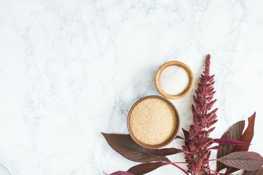 amaranth grain with oil on a white background with space for text. High quality photo