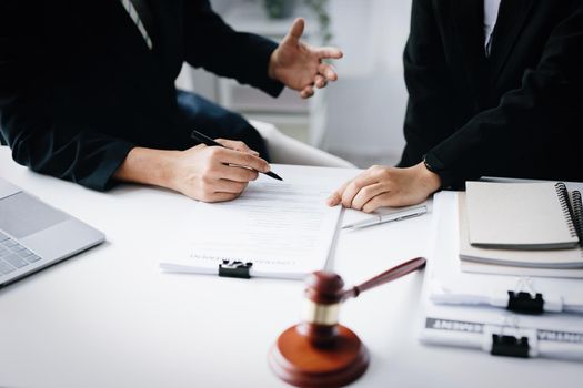 Law, Consultation, Agreement, Contract, Attorney or Lawyer holding a pen is consulting with a client to explain the pattern of answering questions before going to court to decide a lawsuit