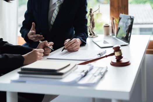 Law, Consultation, Agreement, Contract, Attorney or Lawyer holding a pen is consulting with a client to explain the pattern of answering questions before going to court to decide a lawsuit