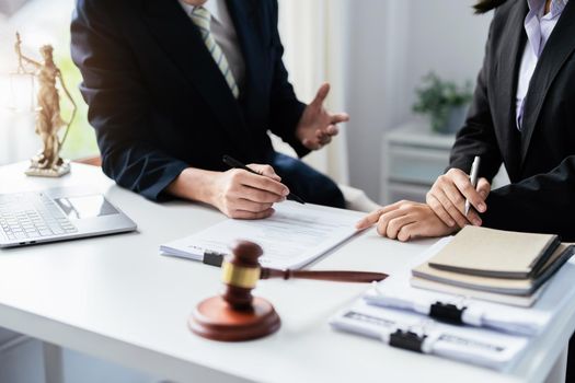 Law, Consultation, Agreement, Contract, Attorney or Lawyer holding a pen is consulting with a client to explain the pattern of answering questions before going to court to decide a lawsuit