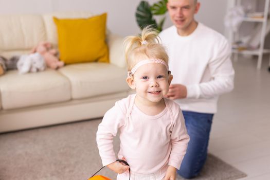 Cochlear implant on the child girl head. Hearing aid and deafness and innovative health technology