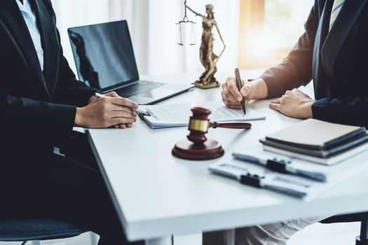 Law, Consultation, Agreement, Contract, Attorney or Lawyer holding a pen is consulting with a client to explain the pattern of answering questions before going to court to decide a lawsuit