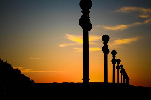 Silhouette of street lanterns with sunset sky. Silhouette of a street lamp post during a beautiful sunset and beautiful sky.