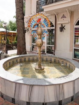 SVETLOGORSK, RUSSIA - July 21, 2019. Famous landmark - fountain Bird of Gauja on Central square. Metal statue with stained glass feathers.