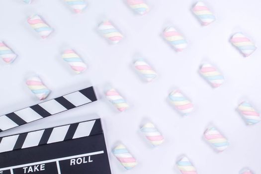 Movie clapperboard White background. White background with twisted marshmallow pattern. Mock up.