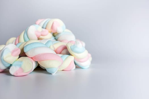 Colored twisted marshmallow on white