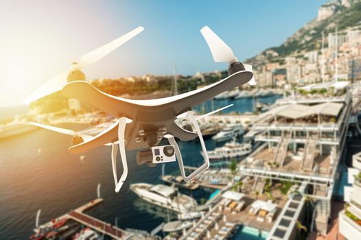 Drone with digital camera flying over an harbour: 3D rendering
