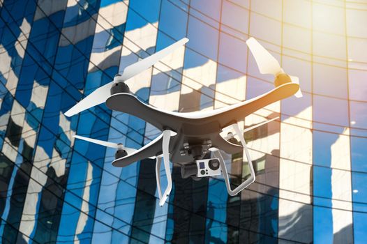 Drone with digital camera flying in front of a modern palace: 3D rendering