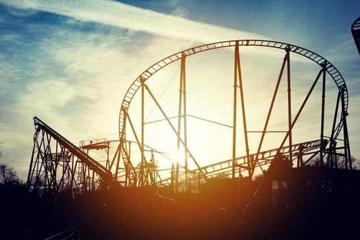 Silhouette of roller coaster in the sunset