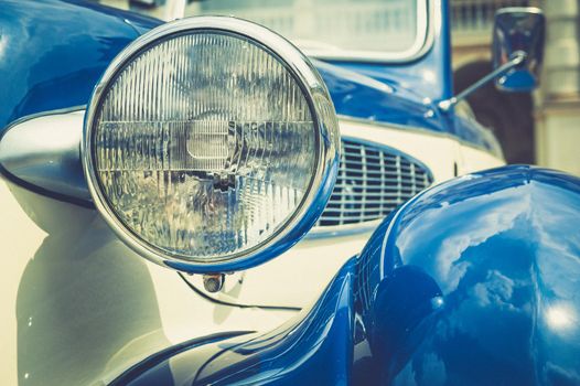 Vintage classic car front view with headlight