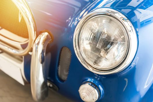 Closeup of a vintage blue sport car in the sunlight