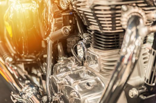 Engine of a powerful motorbike in the sunset