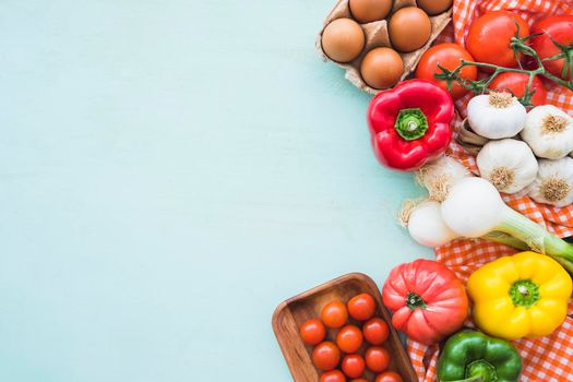 eggs healthy vegetables blue colored background