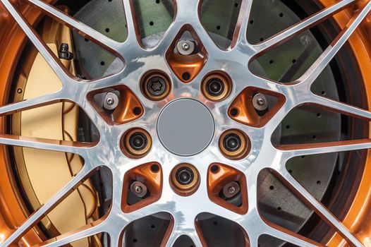 Close up of a modern sport wheel with orange brake