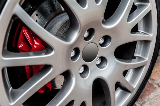 Close up of a modern sport wheel with red brake