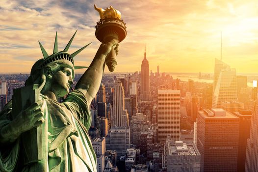 The Statue of Liberty and New York City skyline at dark