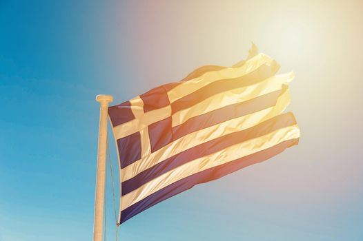 Old flag of the Greece in the wind