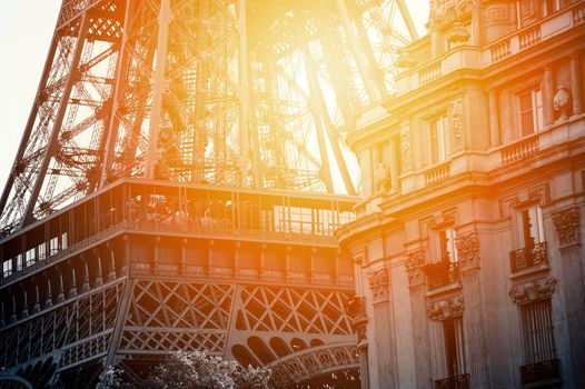 Close up of a black and white tour eiffel and a palace in Paris with sunset.