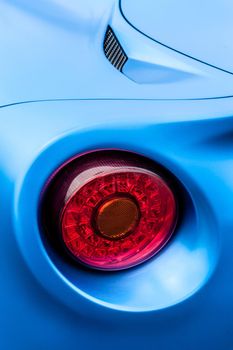Close up of back lights of a blue car