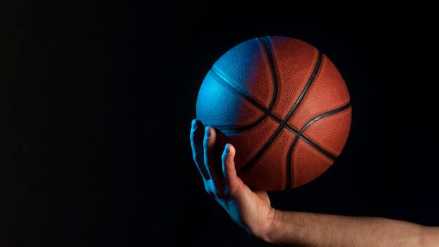 front view basketball held by male hand