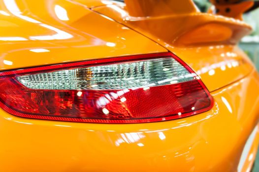 Back light of an orange modern sport car