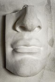 Close up mouth with a nose in sculpture.