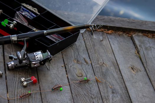 Fishing tackle on the river bank, bait rod, spinning rod, fish. Nature. Selective focus
