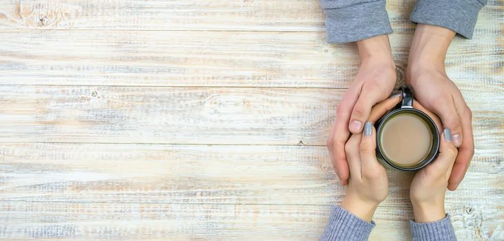 Concept of male and female hands, love and coffee