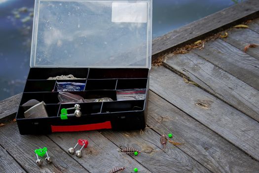 Fishing tackle on the river bank, bait rod, spinning rod, fish. Nature. Selective focus