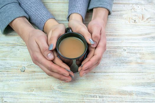 Concept of male and female hands, love and coffee