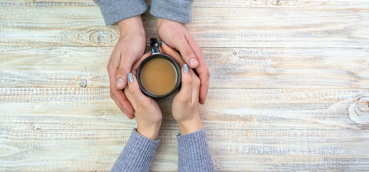 Concept of male and female hands, love and coffee